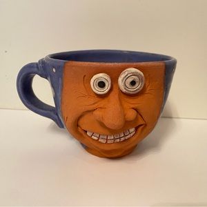 HANDMADE CRAFTED MUG POTTERY FUNNY FACE BLUE BROWN EYES NOSE TEETH J. COTTON